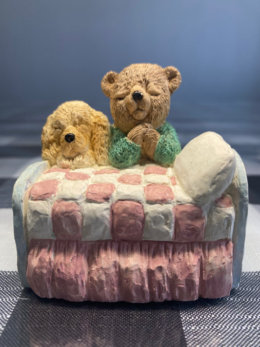 Teddy and dog praying in the bed