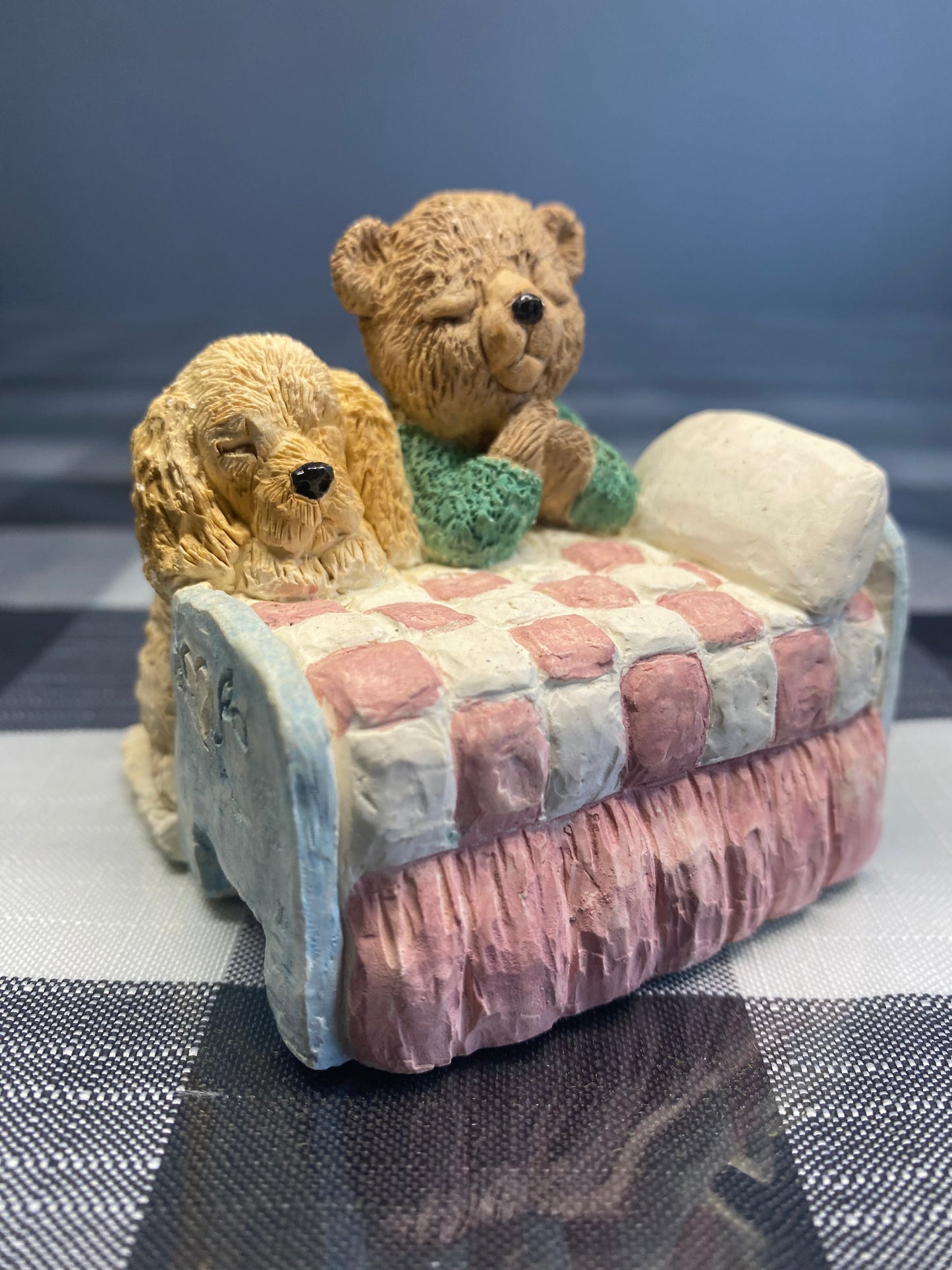 Teddy and dog praying in the bed