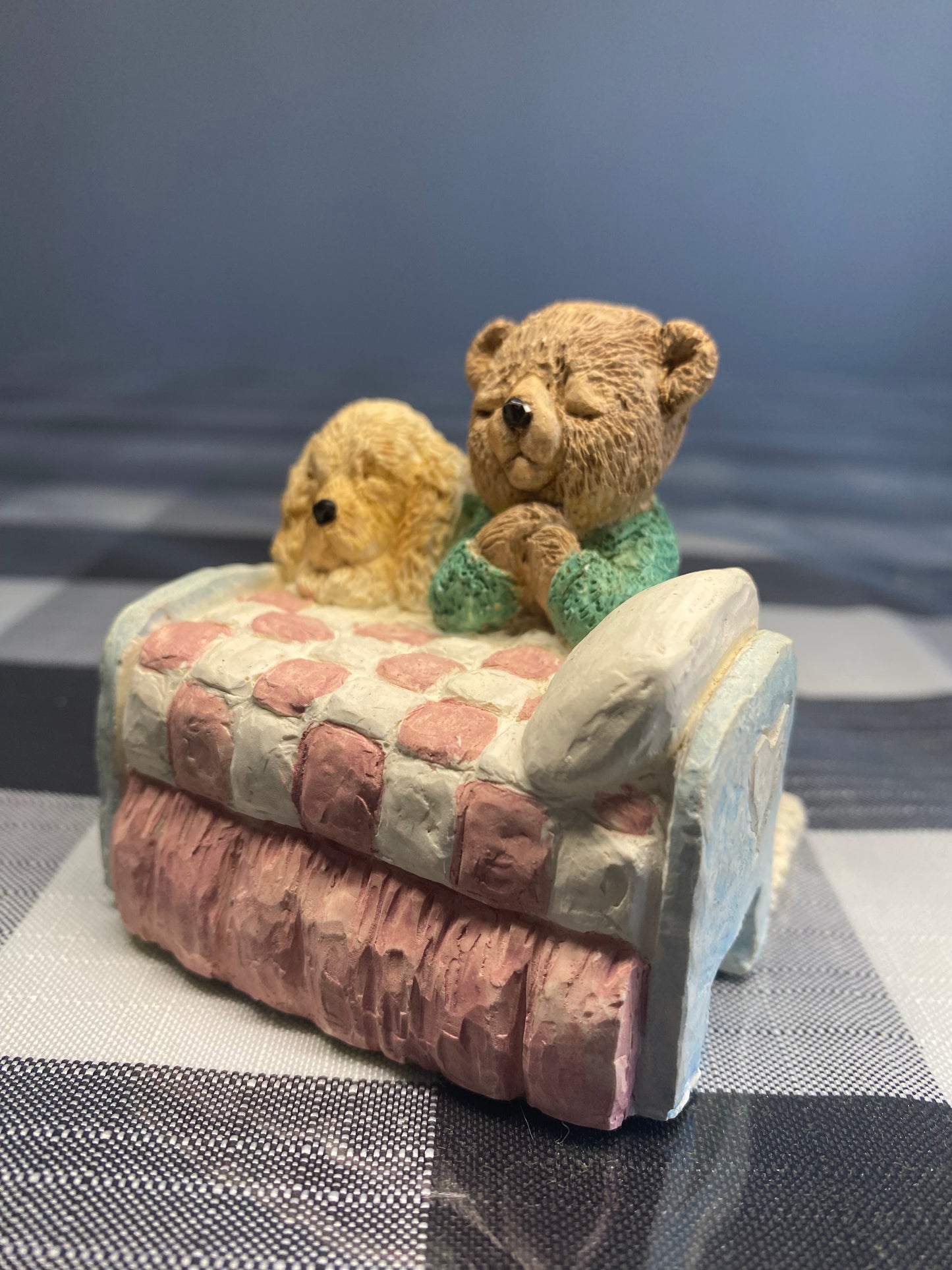 Teddy and dog praying in the bed